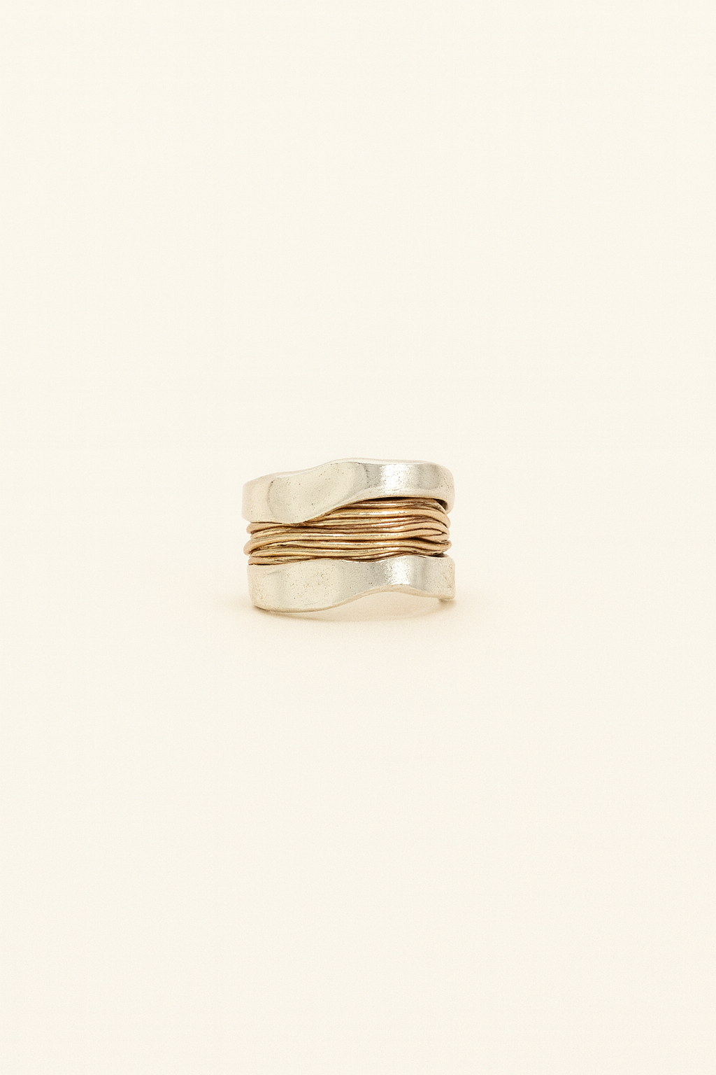 Silver ring with golden threads