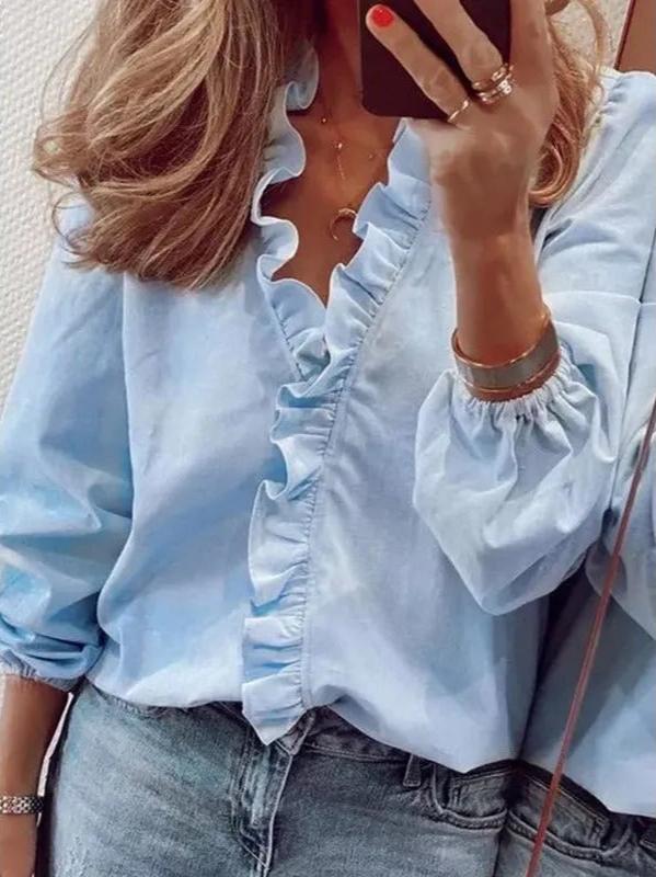 Casual summer blouse with long sleeves, perfect for warm weather with added coverage.