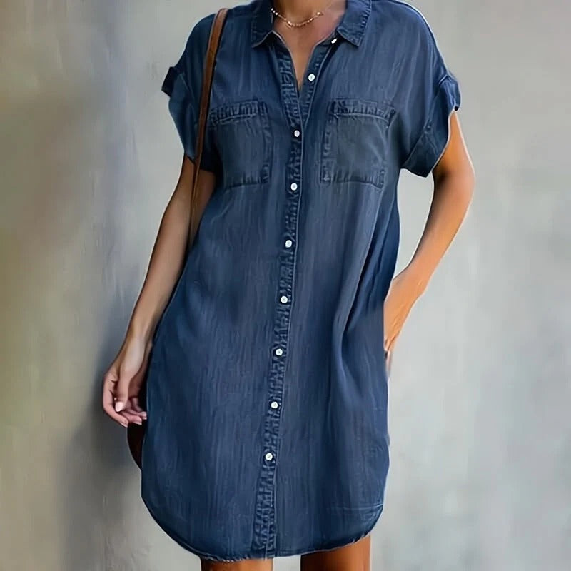 Elegant denim dress featuring a flattering silhouette and timeless fabric, perfect for versatile styling and any occasion.