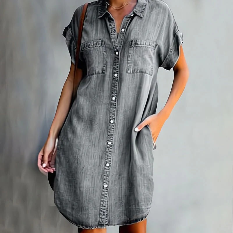 Elegant denim dress featuring a flattering silhouette and timeless fabric, perfect for versatile styling and any occasion.