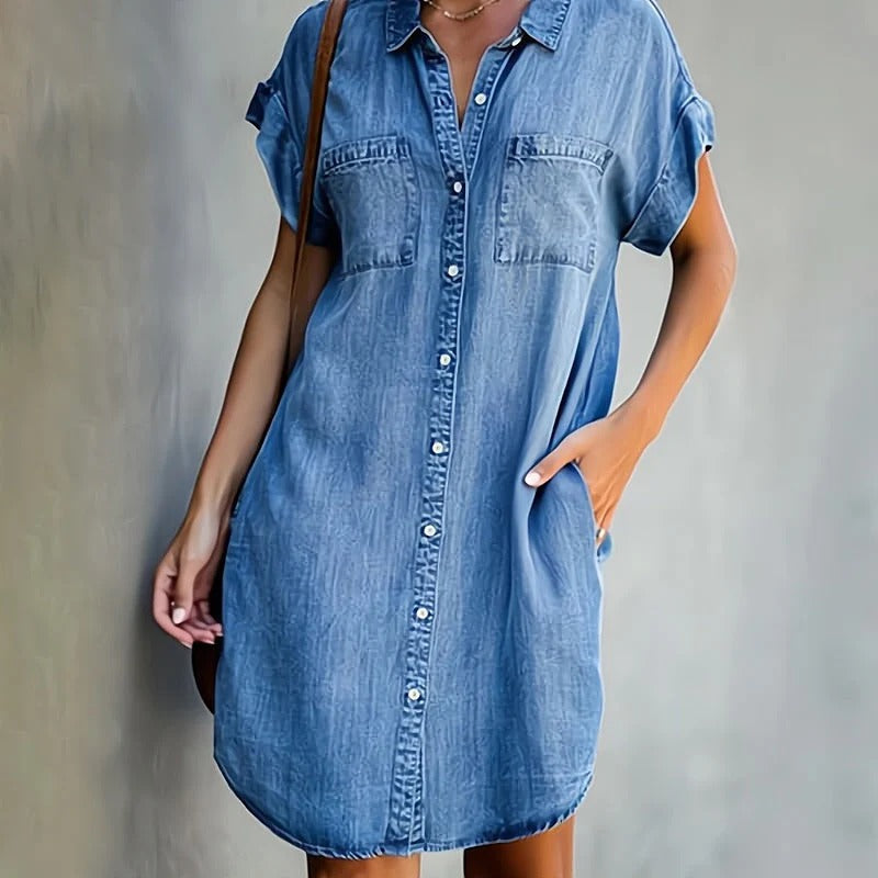 Elegant denim dress featuring a flattering silhouette and timeless fabric, perfect for versatile styling and any occasion.