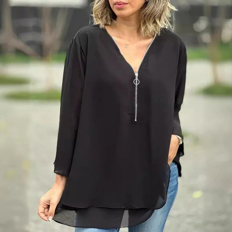  Elegant top with zipper detail, perfect for layering and versatile styling.