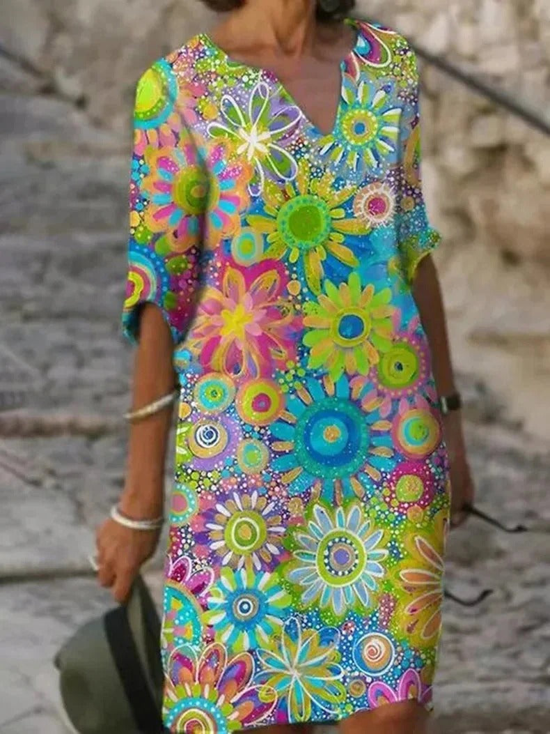 Sunny floral dress with a comfortable fit, perfect for summer days and warm weather.