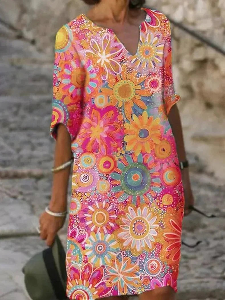 Sunny floral dress with a comfortable fit, perfect for summer days and warm weather.