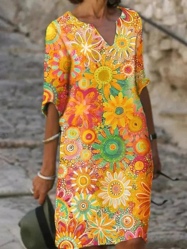 Sunny floral dress with a comfortable fit, perfect for summer days and warm weather.